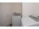 The laundry room features a modern washer and dryer in a bright space at 17319 Terry Ave, Port Charlotte, FL 33948