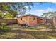 Full view of the fenced-in backyard showing the wooden fence, patio, and external AC unit at 1818 53Rd S St, Gulfport, FL 33707