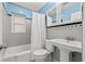 Bathroom featuring gray tile, black and white accent tile, and modern fixtures at 1818 53Rd S St, Gulfport, FL 33707