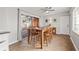 Dining room with wooden table set, ceiling fan, and sliding glass door to outdoor patio at 1818 53Rd S St, Gulfport, FL 33707