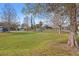 A view of the neighborhood park showing the green lawn, trees, and nearby streets at 1818 53Rd S St, Gulfport, FL 33707