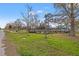 A view of a neighborhood park with walking bridge and a crosswalk sign at 1818 53Rd S St, Gulfport, FL 33707