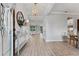 Elegant entryway features light wood-look tile flooring, shiplap accent wall, and stylish decor at 18329 Roseate Dr, Lutz, FL 33558