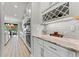 Elegant kitchen with white subway tile backsplash and wine storage rack at 18329 Roseate Dr, Lutz, FL 33558