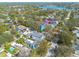 Aerial view of the property and neighborhood; the home has a large manicured lawn and detached garage at 243 28Th N Ave, St Petersburg, FL 33704