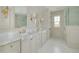 Luxurious bathroom featuring dual sinks, marble countertops, and decorative lighting at 243 28Th N Ave, St Petersburg, FL 33704