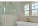 Spa-like bathroom with a modern tub, glass shower, and natural light at 243 28Th N Ave, St Petersburg, FL 33704