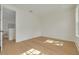 Sun-drenched room with hardwood flooring, neutral walls, and an open doorway at 243 28Th N Ave, St Petersburg, FL 33704