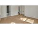 Bedroom with hardwood floors and doors to a bathroom and hallway space at 243 28Th N Ave, St Petersburg, FL 33704