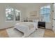 Serene bedroom with bright neutral tones, light hardwood floors, and large windows at 243 28Th N Ave, St Petersburg, FL 33704