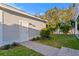 The garage is a detached structure with white siding and landscaping, surrounded by a white vinyl fence at 243 28Th N Ave, St Petersburg, FL 33704