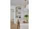 Kitchen island with marble countertop and barstool seating; featuring decorative shelving at 243 28Th N Ave, St Petersburg, FL 33704