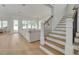 Bright and airy living room with large windows and a staircase leading to the upper level at 243 28Th N Ave, St Petersburg, FL 33704