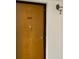 Close-up of unit 203 door with classic hardware and painted trim at 2591 Countryside Blvd # 5203, Clearwater, FL 33761