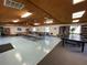 Large recreation room features tables, chairs, ping pong and library at 2591 Countryside Blvd # 5203, Clearwater, FL 33761