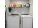 Bright laundry room featuring modern washer and dryer at 25993 Woven Wicker Bnd, Lutz, FL 33559