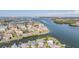 Aerial view of a coastal community with waterfront homes and a scenic waterway at 330 6Th Ave, Indian Rocks Beach, FL 33785