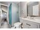 Modern bathroom with a frosted glass shower, stylish vanity and decorative tile accents at 330 6Th Ave, Indian Rocks Beach, FL 33785