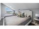 Cozy bedroom featuring two twin beds and a window with neighborhood views at 330 6Th Ave, Indian Rocks Beach, FL 33785