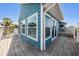 Exterior view of the deck showcasing its size and the outdoor dining area at 330 6Th Ave, Indian Rocks Beach, FL 33785