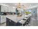 Modern kitchen featuring a large island, white cabinets, and stainless steel appliances overlooking a scenic view at 330 6Th Ave, Indian Rocks Beach, FL 33785