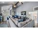 Bright and airy living room featuring high ceilings, a large sofa, and an adjacent dining area at 330 6Th Ave, Indian Rocks Beach, FL 33785