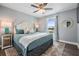 Serene main bedroom with a comfortable bed, soft lighting, and a window offering a picturesque view at 330 6Th Ave, Indian Rocks Beach, FL 33785