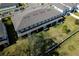 Aerial view of a two-story home showcasing the backyard, roof, and surrounding landscape at 3808 Cat Mint St, Tampa, FL 33619