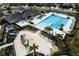 Aerial view of community pool and recreation area including a pool, playground, and lounge area at 3808 Cat Mint St, Tampa, FL 33619