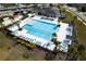 Aerial view of a pool area, with chairs, palm trees and other amenities at 3808 Cat Mint St, Tampa, FL 33619