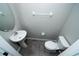 Cozy powder room with pedestal sink and tile flooring at 3808 Cat Mint St, Tampa, FL 33619