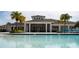 Beautiful clubhouse located by the pool, perfect for relaxation and entertainment with lovely palm trees at 3808 Cat Mint St, Tampa, FL 33619