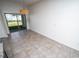 Dining area with hanging pendant light fixture and sliding glass doors to the outdoor patio at 3808 Cat Mint St, Tampa, FL 33619