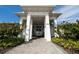 Community entrance featuring white columns and manicured landscaping at 3808 Cat Mint St, Tampa, FL 33619