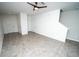 Expansive living room with tile flooring and a modern ceiling fan at 3808 Cat Mint St, Tampa, FL 33619