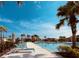 Inviting pool area with lush tropical landscaping, lounge chairs, and clear blue skies perfect for a day of relaxation at 3808 Cat Mint St, Tampa, FL 33619