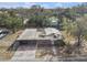 Aerial view of a brick home featuring fenced yard with covered parking at 3817 N 54Th St, Tampa, FL 33619