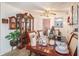 Dining room featuring a large wooden table and a china cabinet with decorative items at 3817 N 54Th St, Tampa, FL 33619