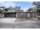 Charming brick home featuring a fenced yard and a covered parking area at 3817 N 54Th St, Tampa, FL 33619