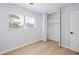 Neutral bedroom with a closet, light hardwood floors, and a bright window at 39035 Citadel Cir, Zephyrhills, FL 33542