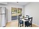 Cozy dining area with slider doors leading to a screened in patio and backyard at 39035 Citadel Cir, Zephyrhills, FL 33542