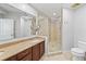 Bright bathroom features a glass enclosed shower and large mirror at 449 S 12Th St # 1105, Tampa, FL 33602