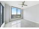 Spacious, bright bedroom with tile floors, large windows, ceiling fan, and neutral walls at 449 S 12Th St # 1105, Tampa, FL 33602