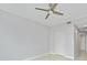 Neutral-toned bedroom featuring a modern ceiling fan, white door, and neutral paint to modernize at 449 S 12Th St # 1105, Tampa, FL 33602