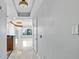 Bright hallway with tile floors and elegant lighting leads into living area with city views at 449 S 12Th St # 1105, Tampa, FL 33602