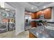 Well-lit kitchen featuring stainless steel appliances, cherry cabinets, and laundry area at 449 S 12Th St # 1105, Tampa, FL 33602