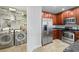 Stainless steel appliances and rich wood cabinets adorn this gourmet kitchen and attached laundry area at 449 S 12Th St # 1105, Tampa, FL 33602