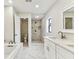 Modern bathroom featuring a separate shower and tub, with double vanity at 4504 Grainary Ave, Tampa, FL 33624