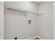 Laundry area with utility hookups and a wire shelf for storage at 4504 Grainary Ave, Tampa, FL 33624