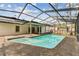 A clean and well-maintained private pool set within a screened-in enclosure at 4504 Grainary Ave, Tampa, FL 33624